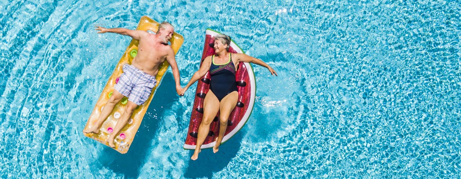 a couple of people in swimsuits in the water